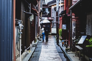 man and woman under umbrella