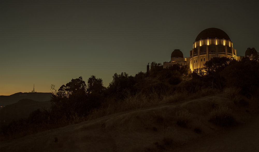 gray and yellow dome observatory at night