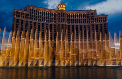 Exterior view of Cebu Grand Hotel at dusk with lights glowing warmly.