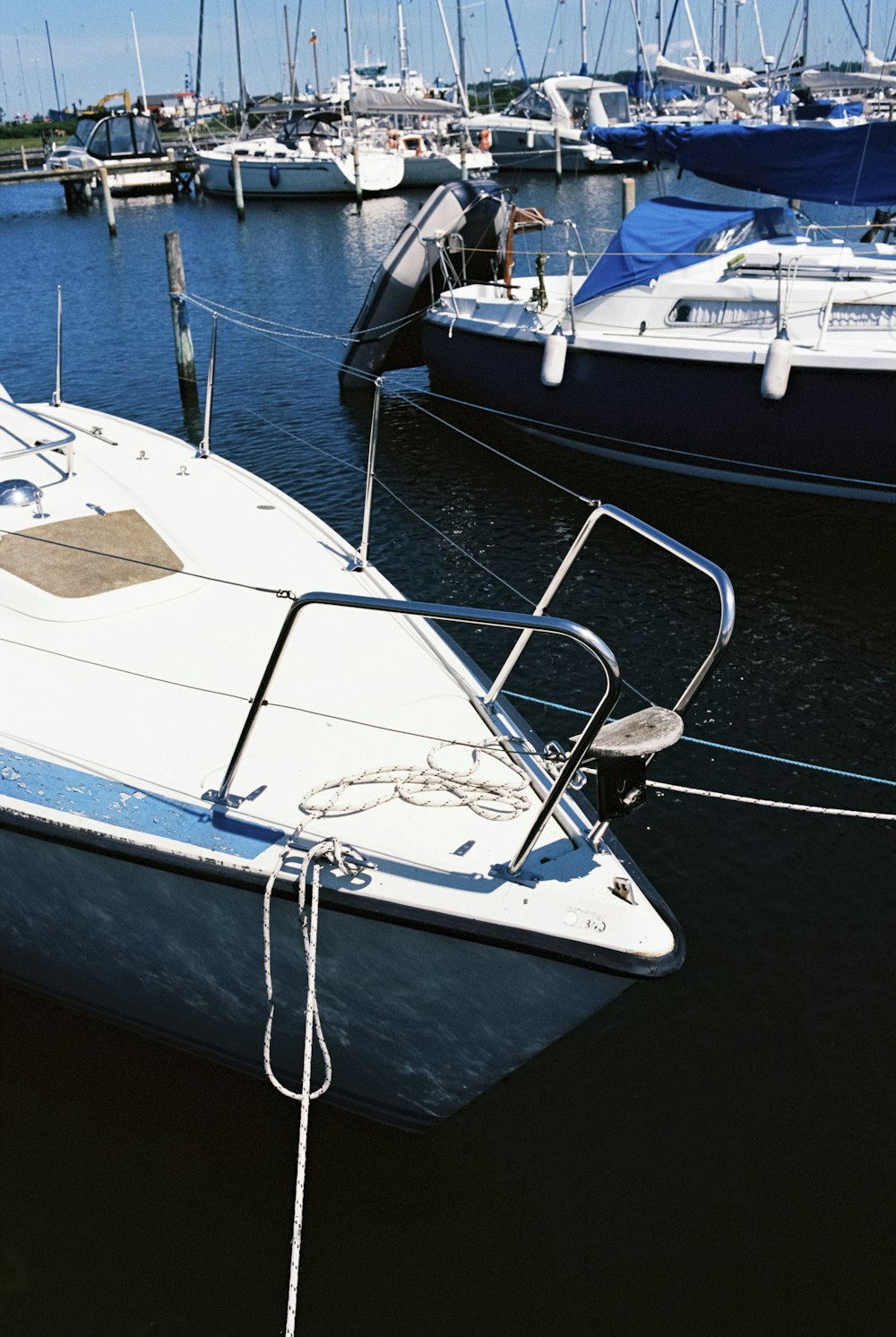 white boats on harbour during daytime