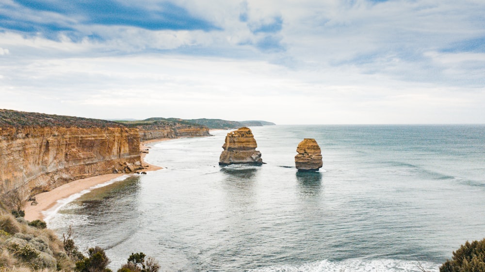 brown coastal stacks during daytime