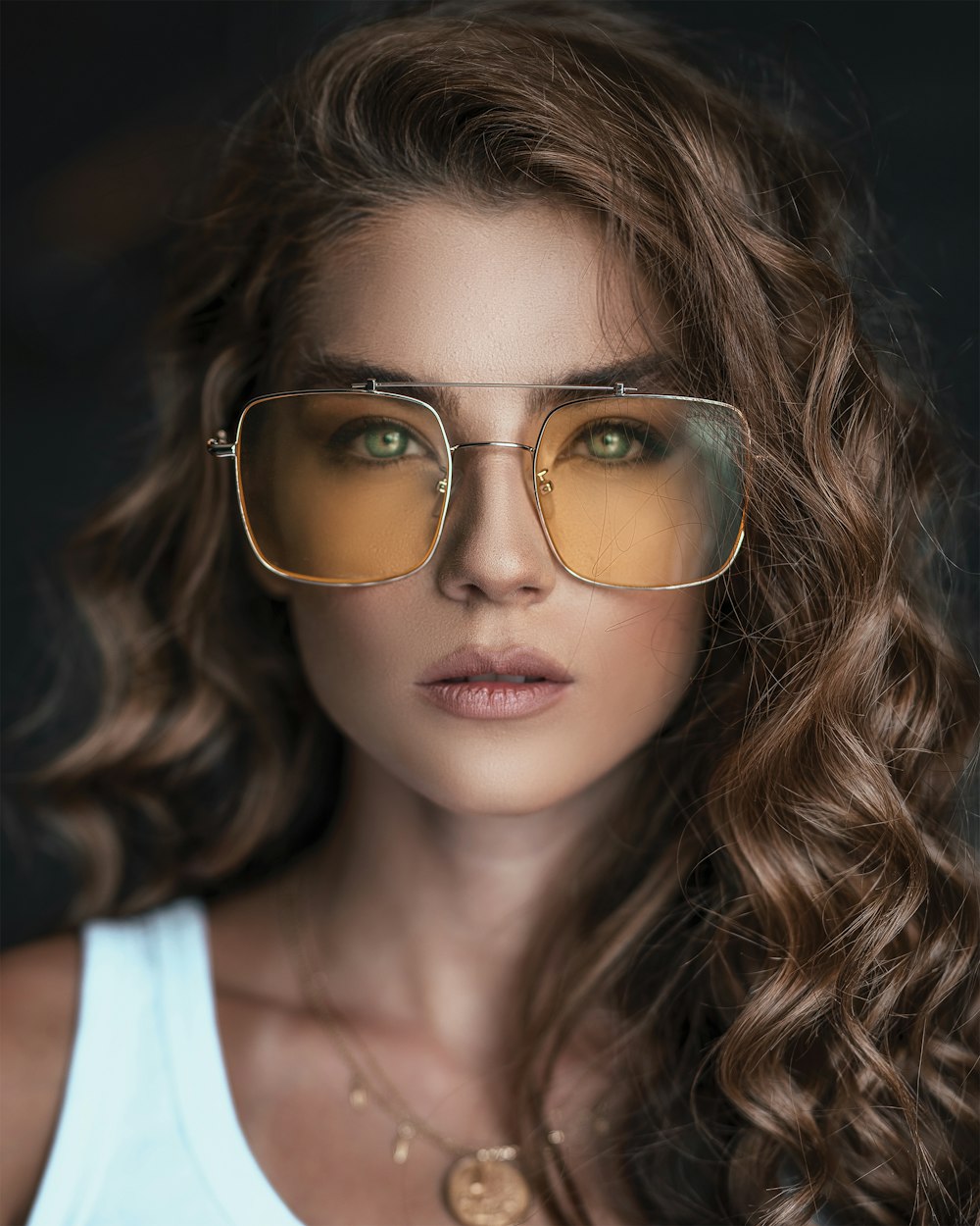 woman wearing brown sunglasses