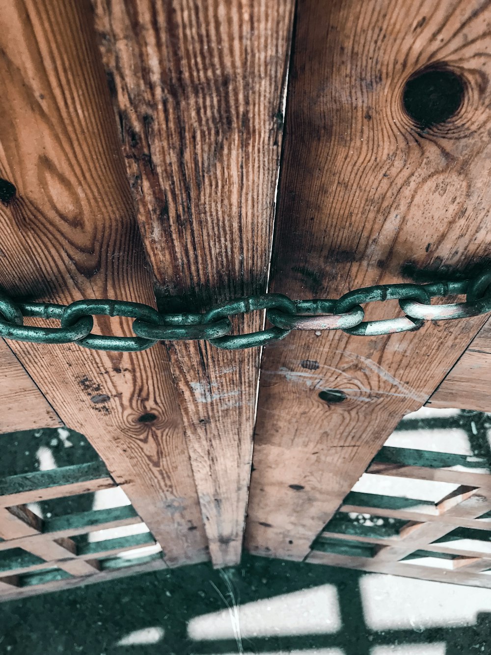 wooden gate locked with chain