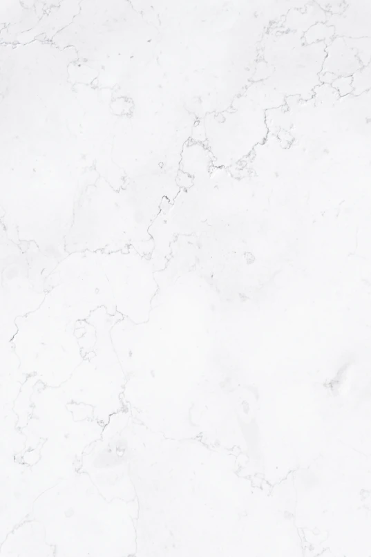 a close up of a white marble surface