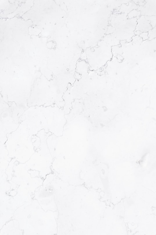 a close up of a white marble surface