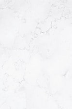 a close up of a white marble surface