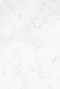 a close up of a white marble surface