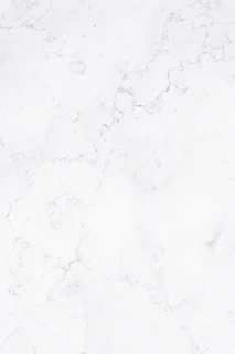 a close up of a white marble surface