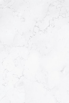 a close up of a white marble surface