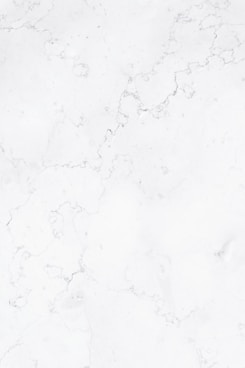 a close up of a white marble surface