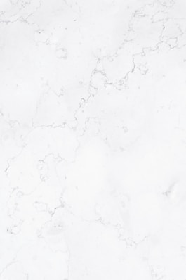 a close up of a white marble surface