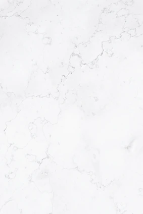 a close up of a white marble surface