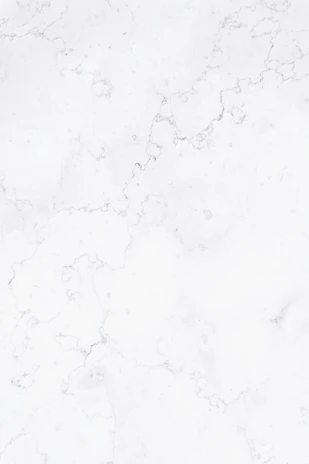 a close up of a white marble surface