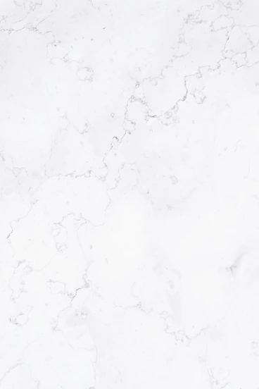 a close up of a white marble surface