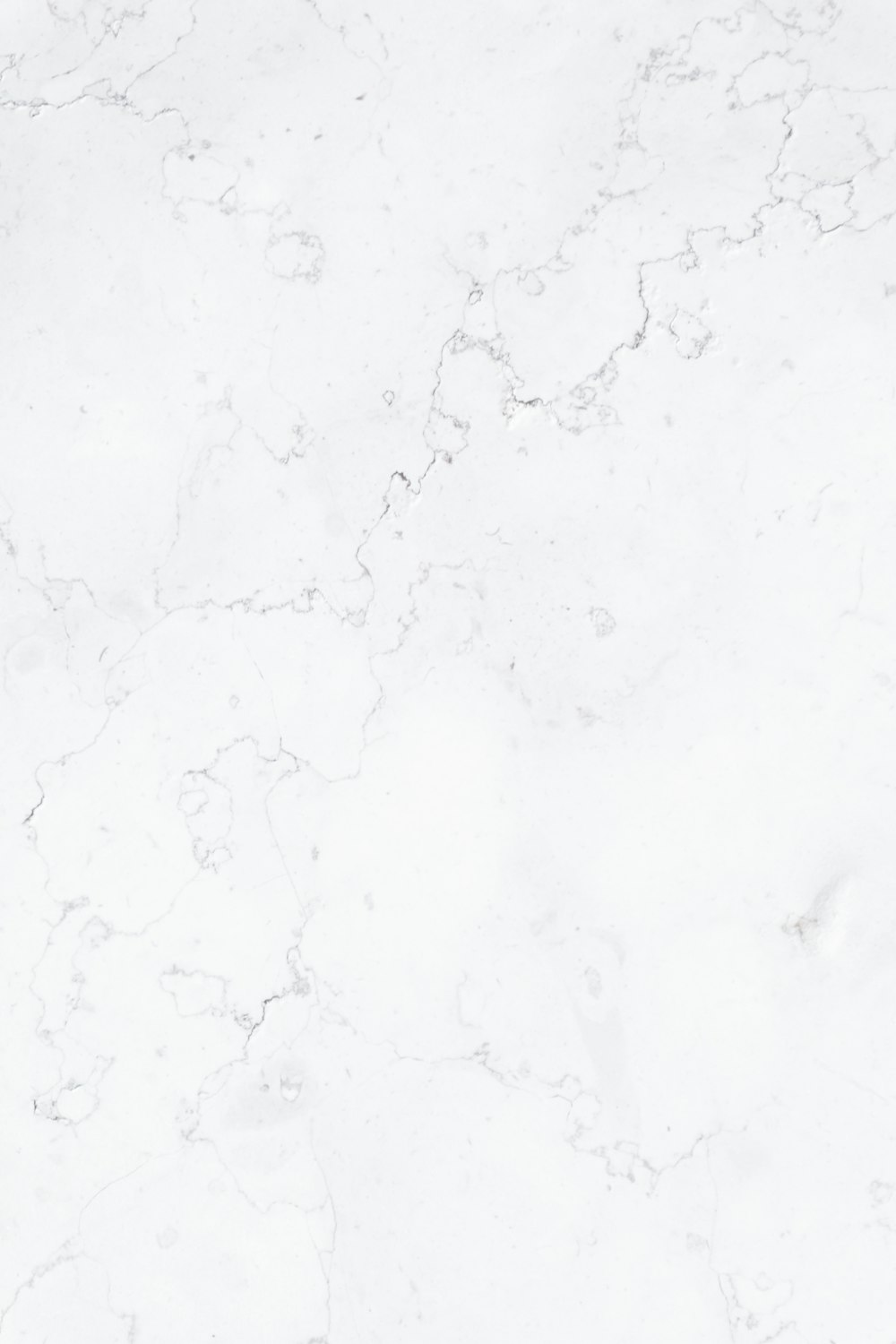 a close up of a white marble surface