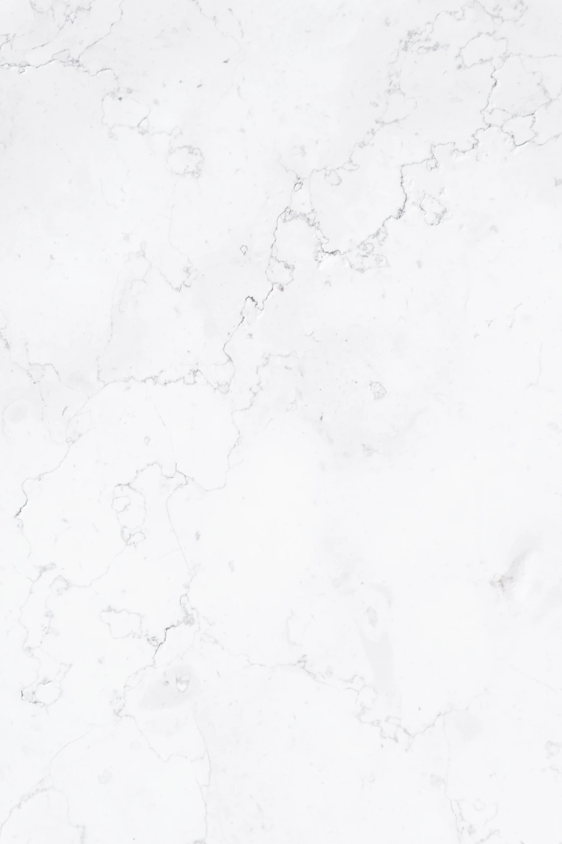 Polished white marble surface showing natural veining