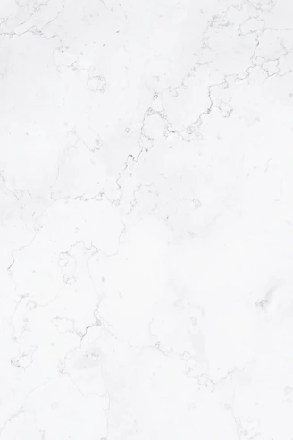 a close up of a white marble surface