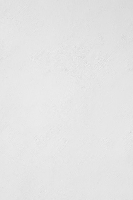 a man riding a snowboard down a snow covered slope