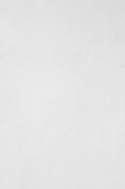 a man riding a snowboard down a snow covered slope