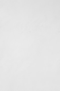 a man riding a snowboard down a snow covered slope