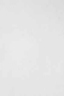 a man riding a snowboard down a snow covered slope