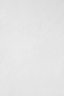 a man riding a snowboard down a snow covered slope