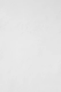 a man riding a snowboard down a snow covered slope