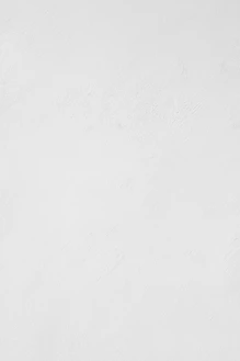 A white wall with a subtle plaster texture