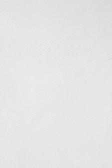 a man riding a snowboard down a snow covered slope