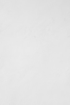 a man riding a snowboard down a snow covered slope