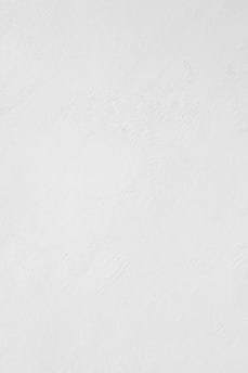 a man riding a snowboard down a snow covered slope
