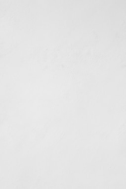 a man riding a snowboard down a snow covered slope