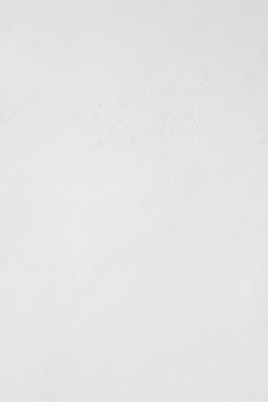 a man riding a snowboard down a snow covered slope