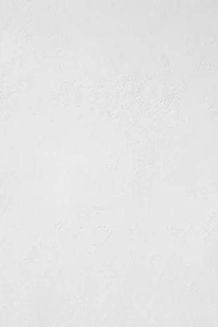 a man riding a snowboard down a snow covered slope