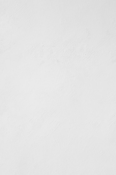 a man riding a snowboard down a snow covered slope