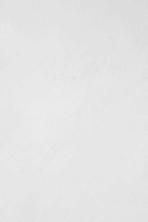 a man riding a snowboard down a snow covered slope