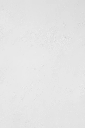 a man riding a snowboard down a snow covered slope