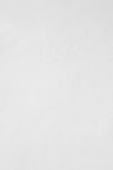 a man riding a snowboard down a snow covered slope