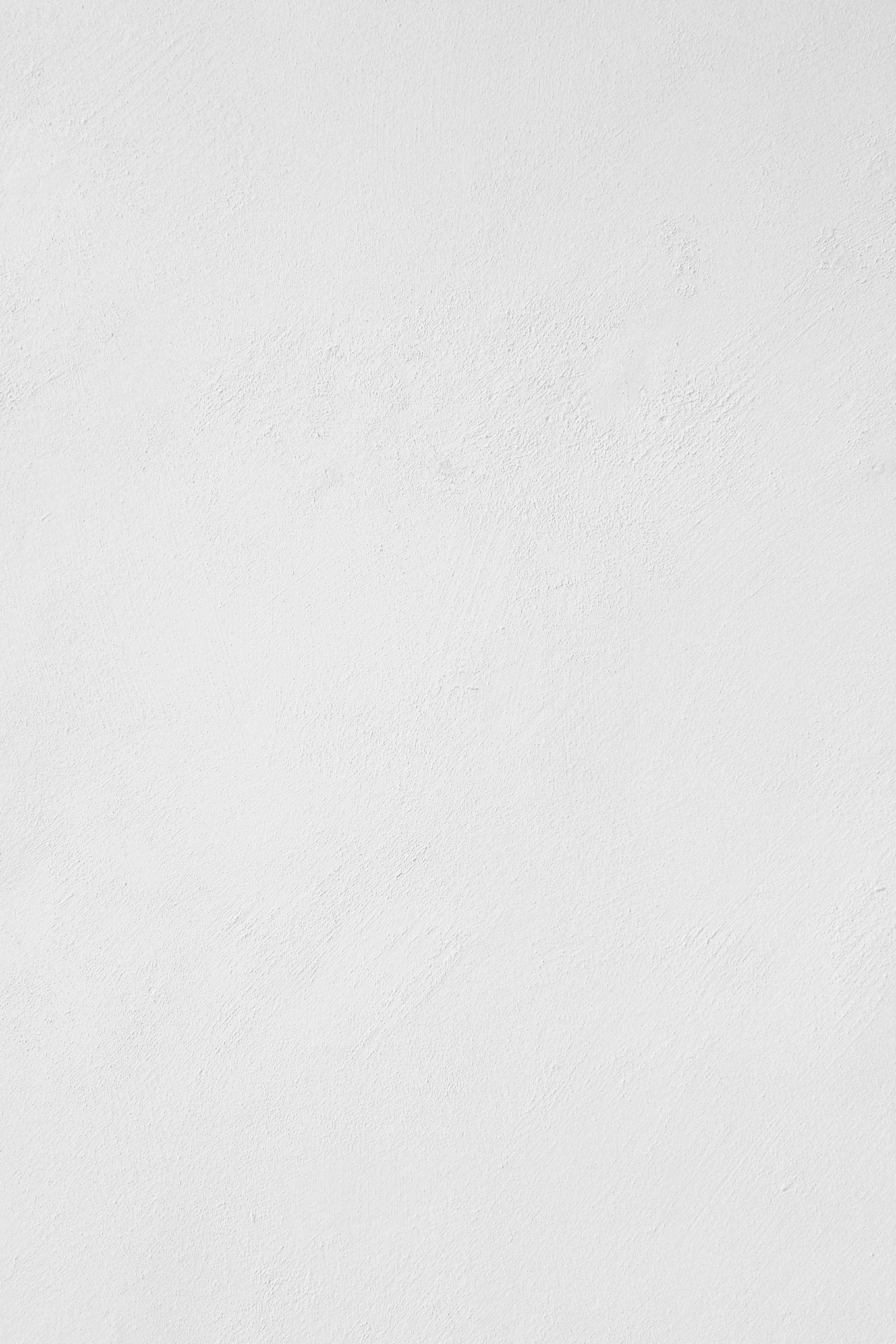 a man riding a snowboard down a snow covered slope