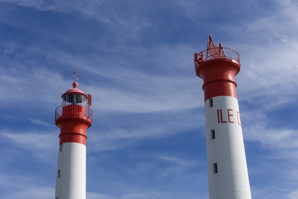 two red-and-white lighthouses