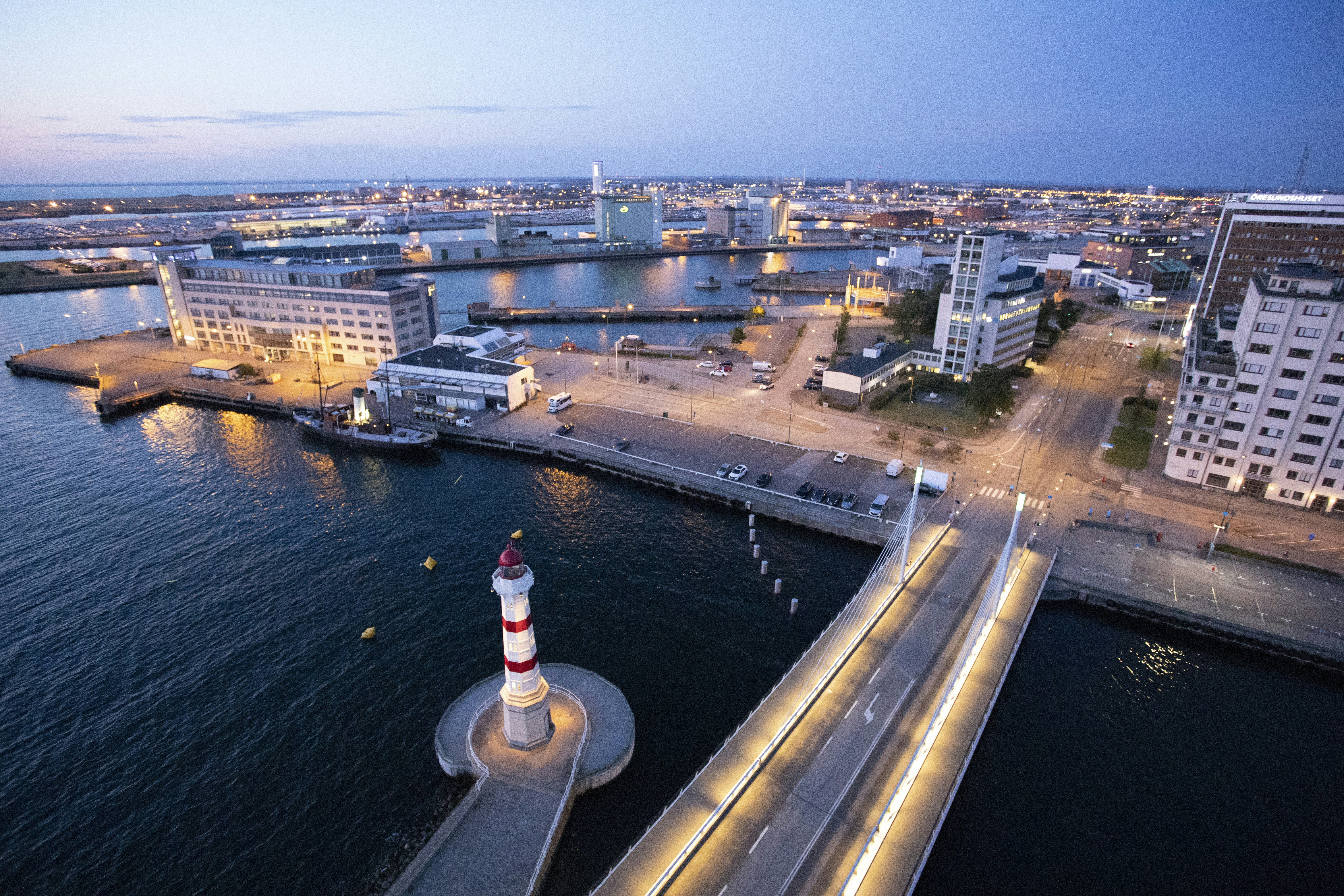 aerial photo of city beside sea