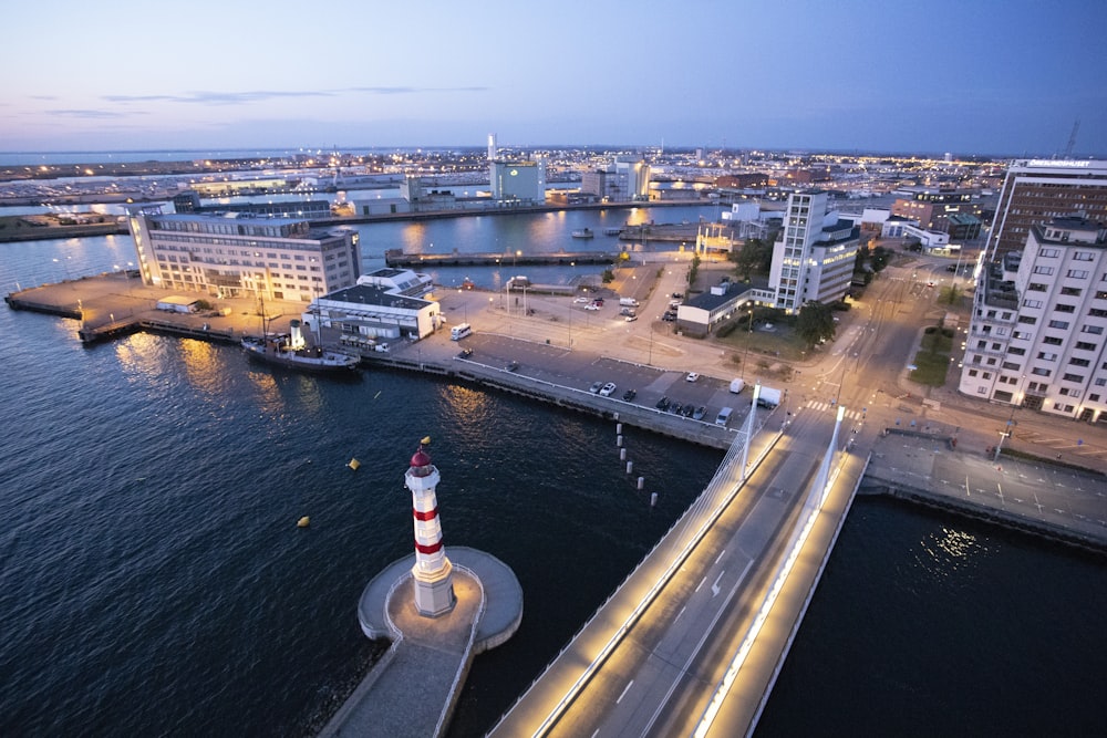 aerial photo of city beside sea