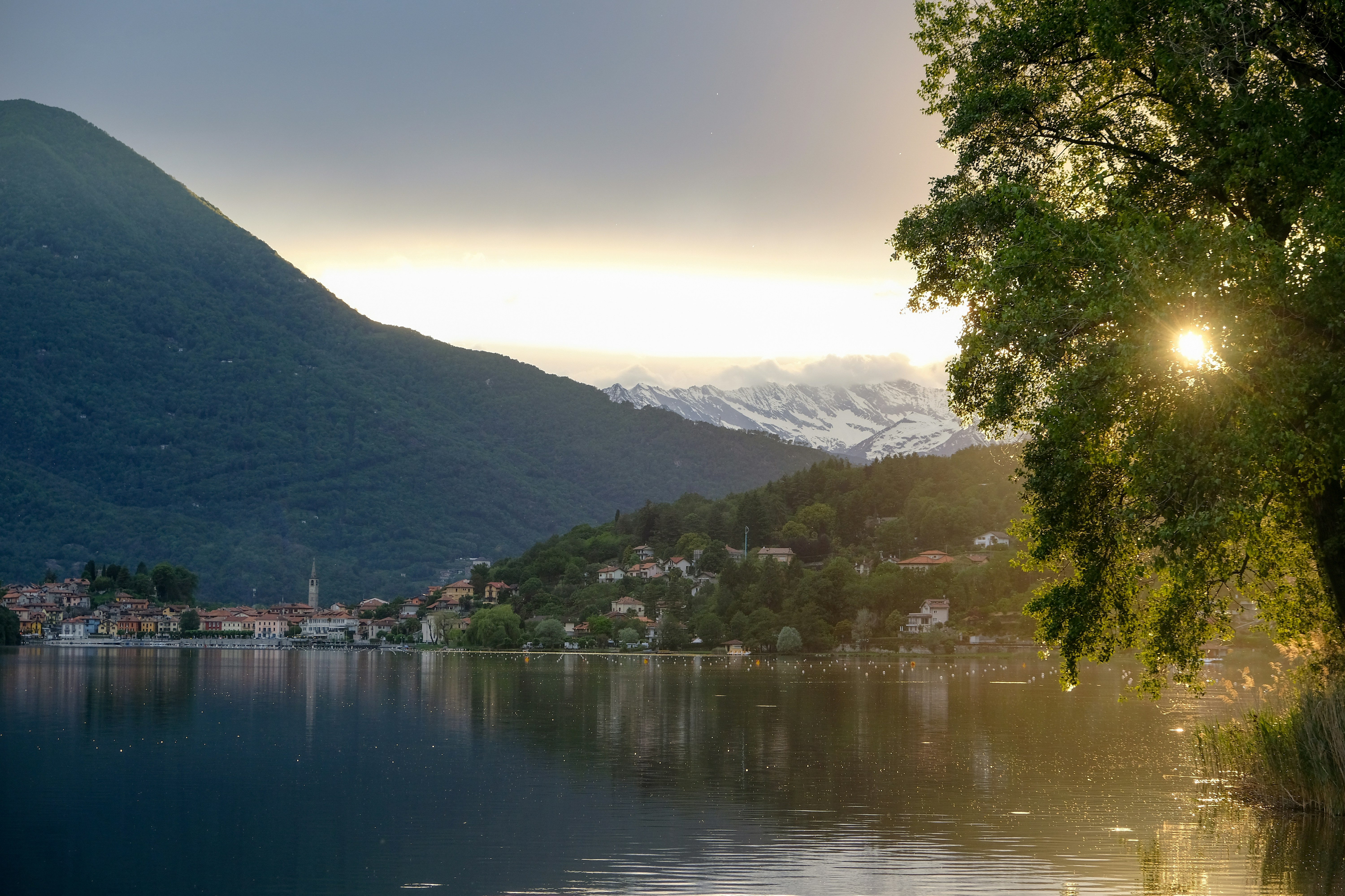body of water near town view during golden hour