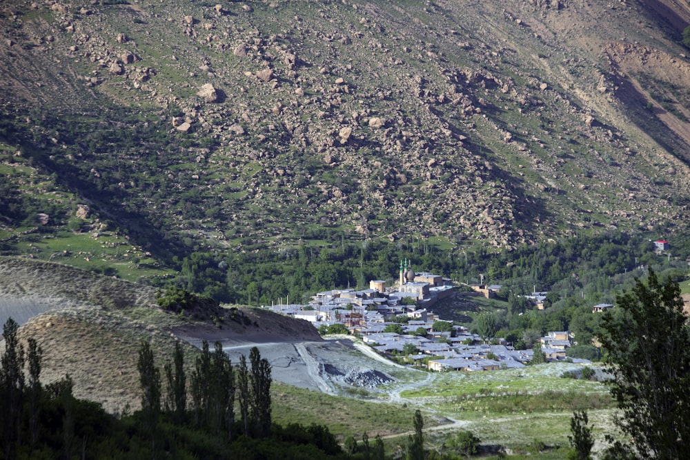 aerial photography of building beside mountain