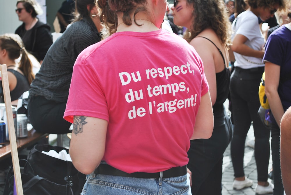 woman standing near group of people