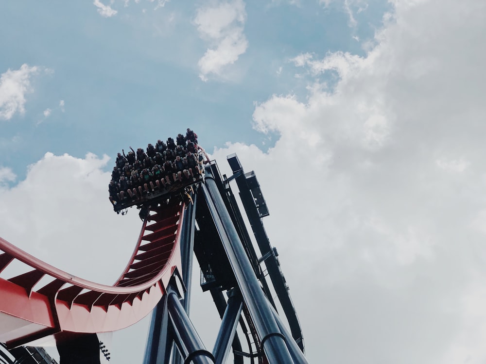 people riding on roller coaster