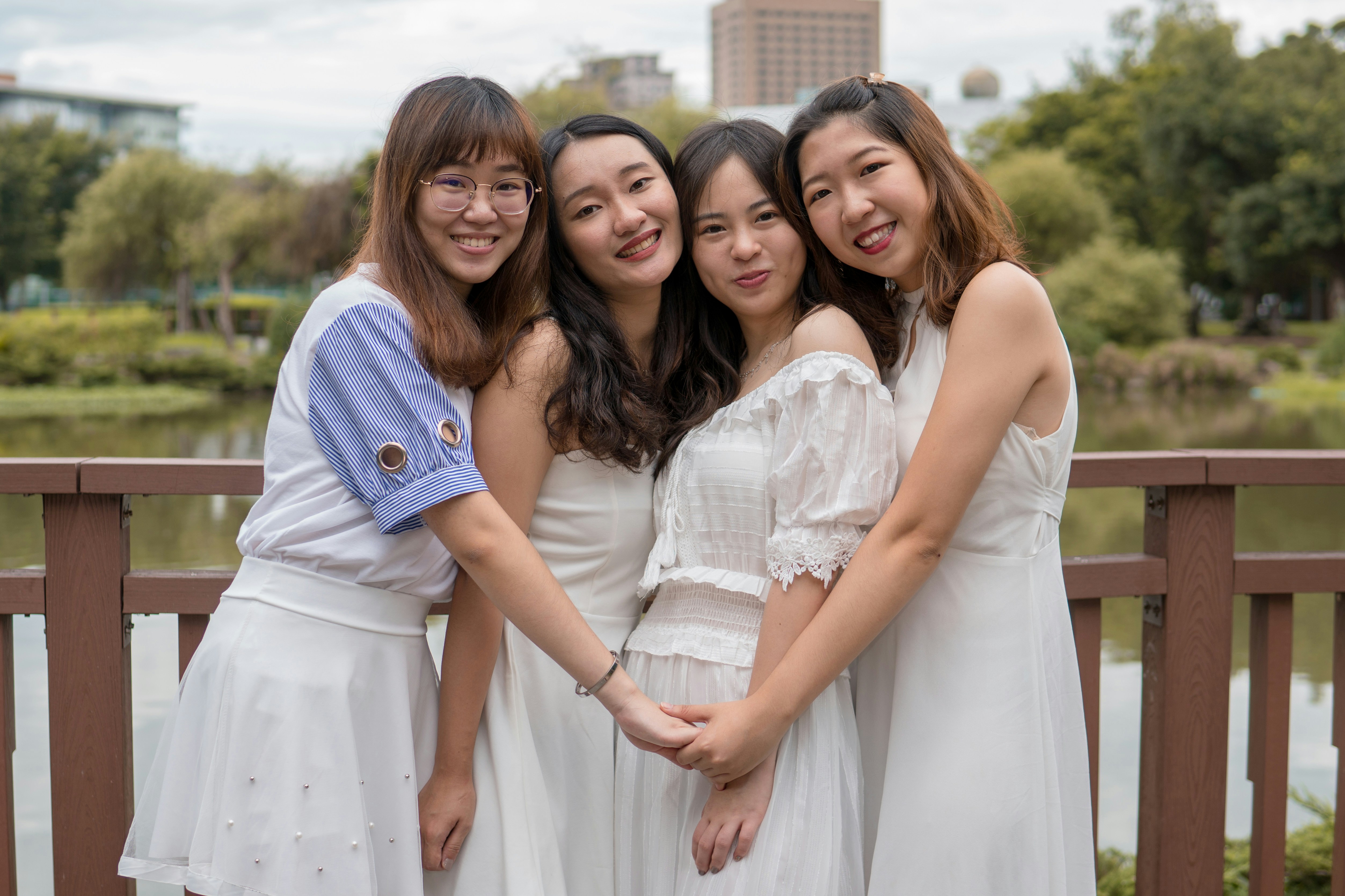 Friends hugging and smiling—pregnancy support network