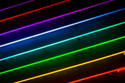 green, orange, red, blue, and purple striped lights neon teams background