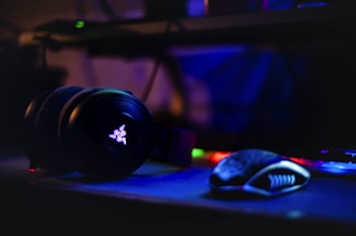 Razer headset near computer mouse