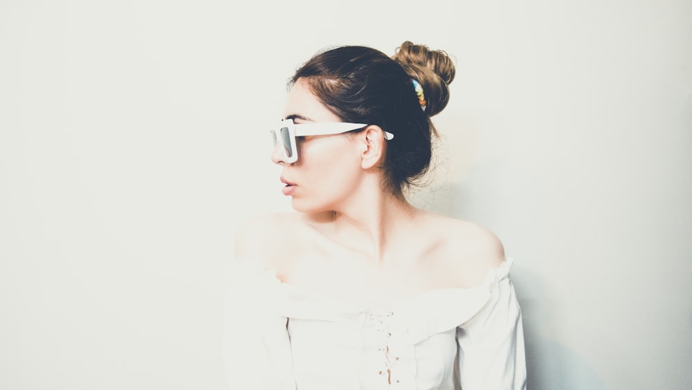 woman wearing white off-shoulder short-sleeved blouse